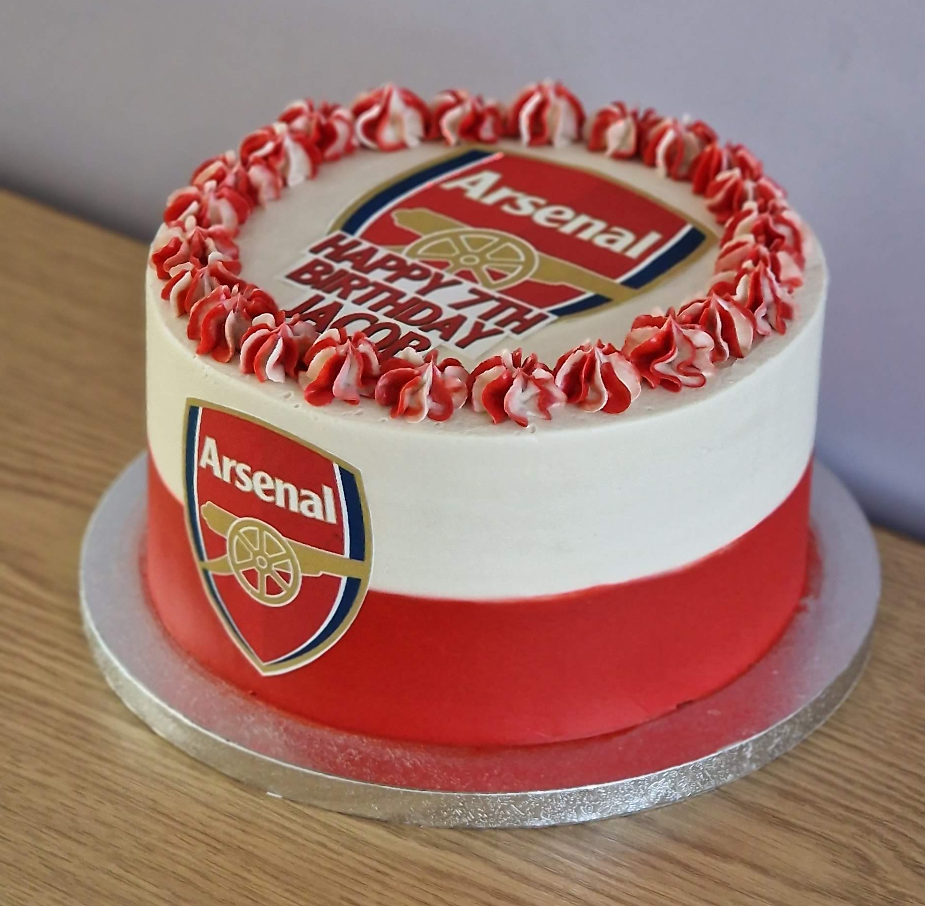 Bespoke tier style Arsenal football club themed birthday cake with red icing curls