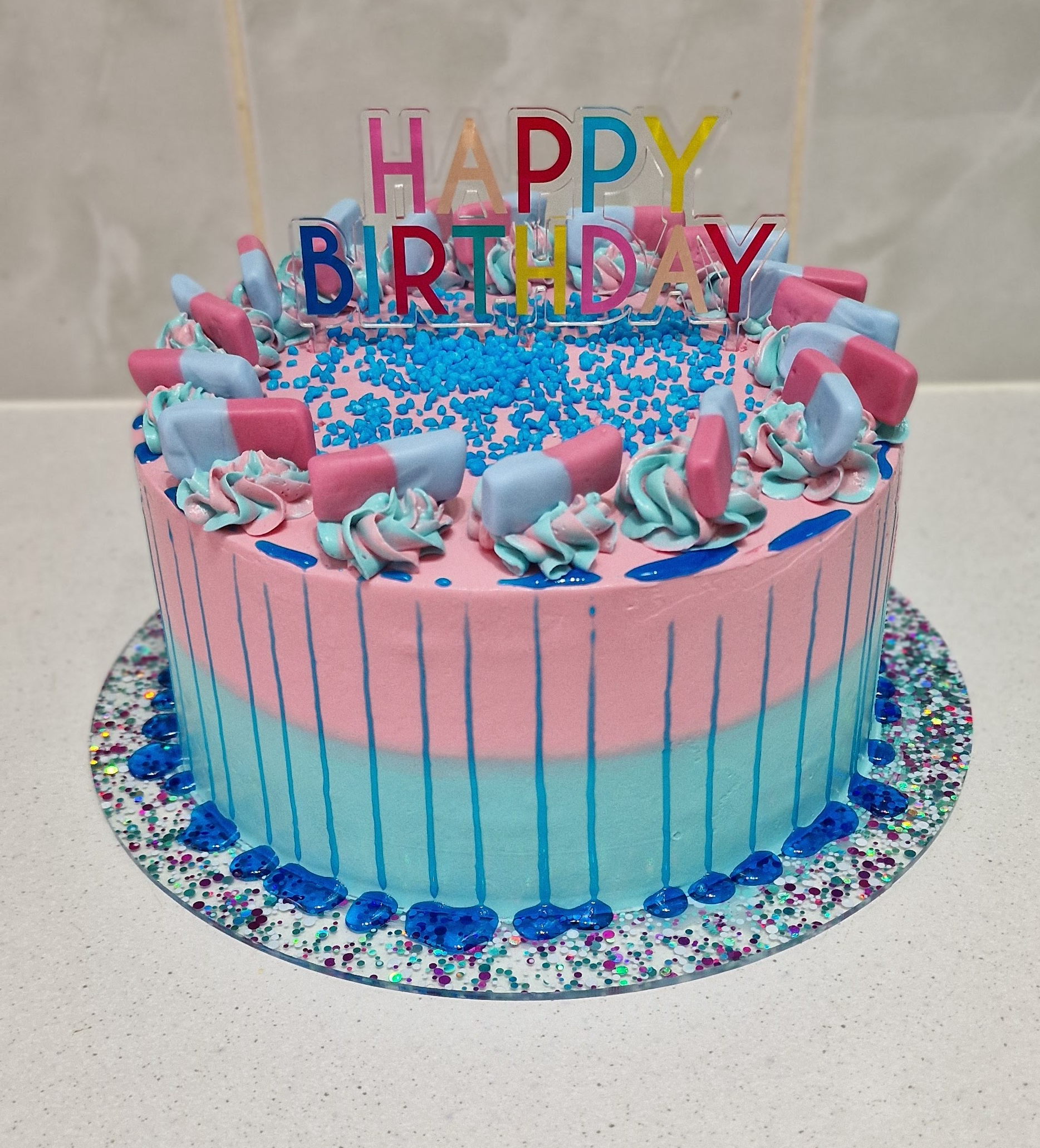 Vibrant blue and pink custom bubblegum-flavoured birthday celebration cake