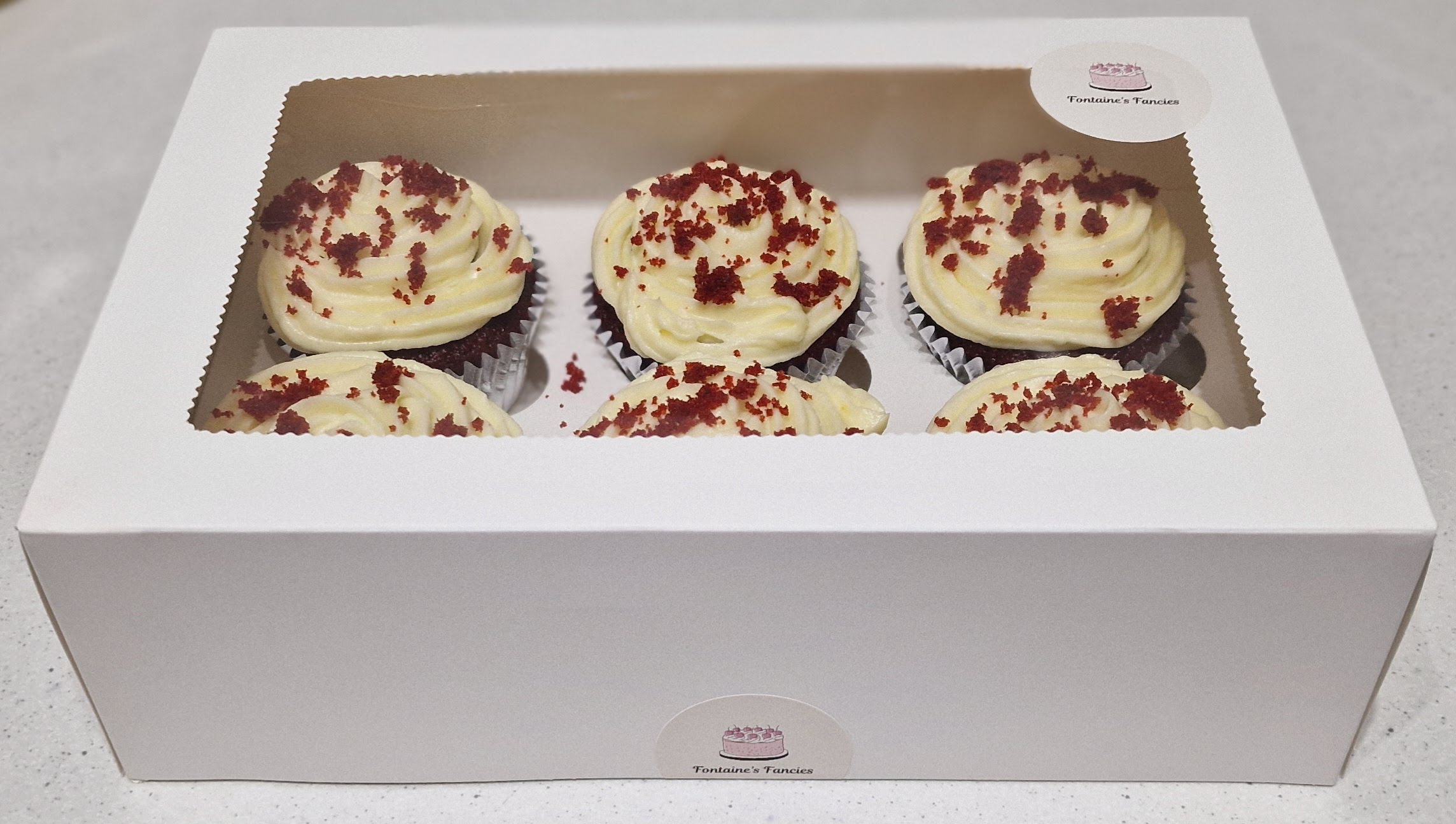 Box of fresh handcrafted red velvet cupcakes by Fontaine Fancies